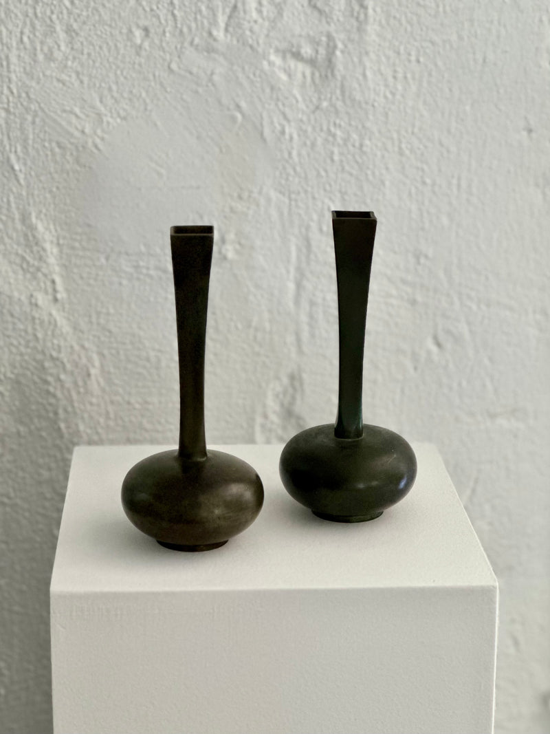 Pair of patinated bronze vases